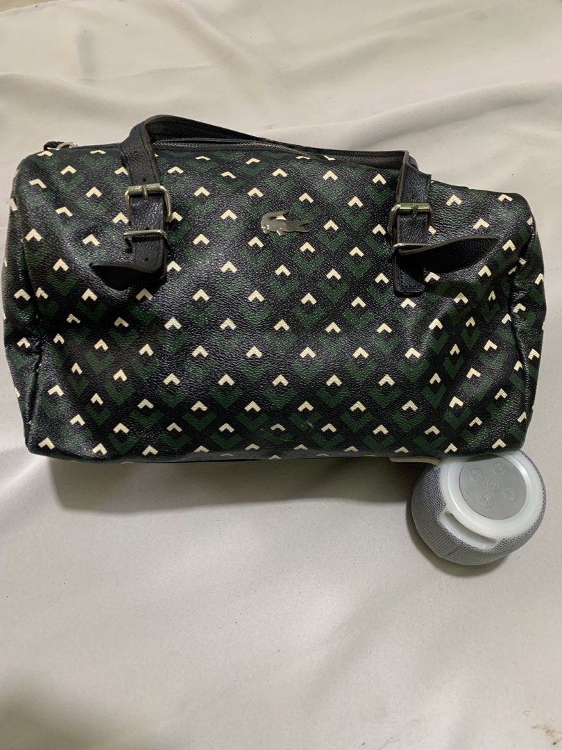 Lacoste Zely Monogram Duffle/Boston Bag (Category: Luxury Bags & Wallets) located in San Jose. Submitted by theluxed (Listing ID 1465199019, Image 1). Description: Width 14 Length 10 Good condition Has a minimal signed of usage No crack on the leather .