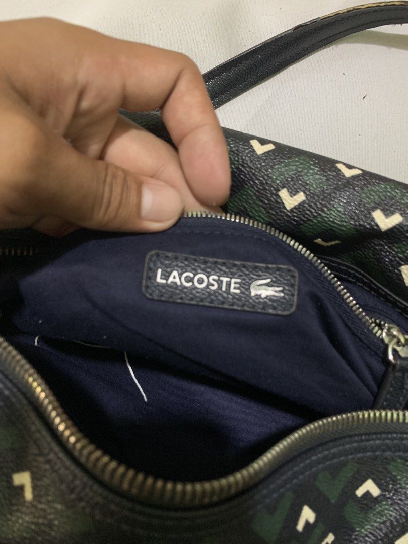 Lacoste Zely Monogram Duffle/Boston Bag (Category: Luxury Bags & Wallets) located in San Jose. Submitted by theluxed (Listing ID 1465199019, Image 3). Description: Width 14 Length 10 Good condition Has a minimal signed of usage No crack on the leather .
