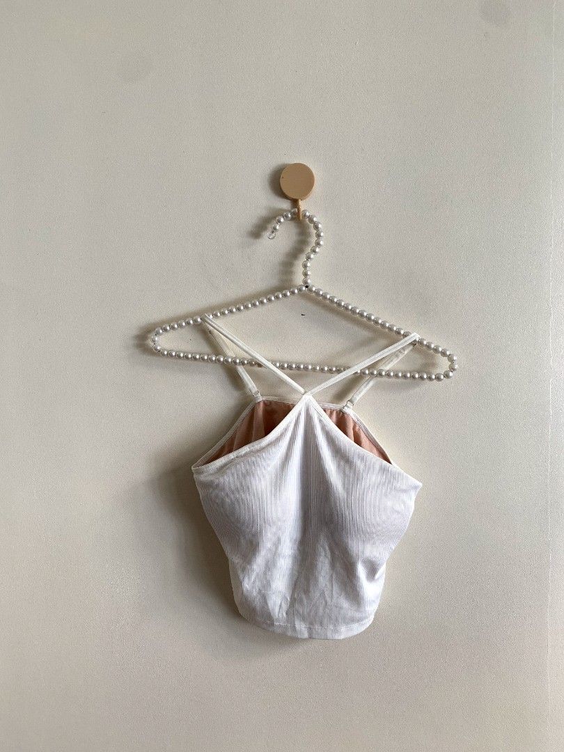 Large - GU Bra Feel Short Halter (Category: Others Tops) located in Castillejos. Submitted by lalainecloset22 (Listing ID 1465205912, Image 3). Description: - Brand/Model: GU Bra Feel Short Halter - Size: Large (L) - Color: Classic White - Design: Criss-cross halter neck with built-in padded cups for convenient, bra-free wear - Material: Soft, stretchy ribbed fabric - Styling: Great as a standalone crop top or layered under jackets and shirts.