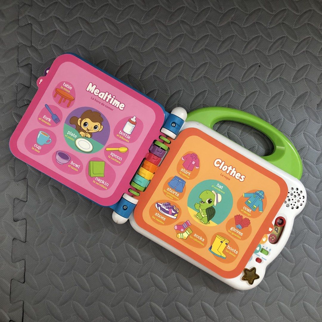 LeapFrog 100 Animals Book (Category: Educational & Learning Toys) located in Balanga. Submitted by lebabyvoyage (Listing ID 1465246908, Image 3). Description: - LeapFrog interactive learning book for toddlers - Bilingual modes in English and Spanish - Teaches animals, rainforest, trees, mealtime, and clothes - Colorful plastic pages with pictures and words - Built-in sound buttons for engaging play - Convenient yellow carrying handle - Battery-op