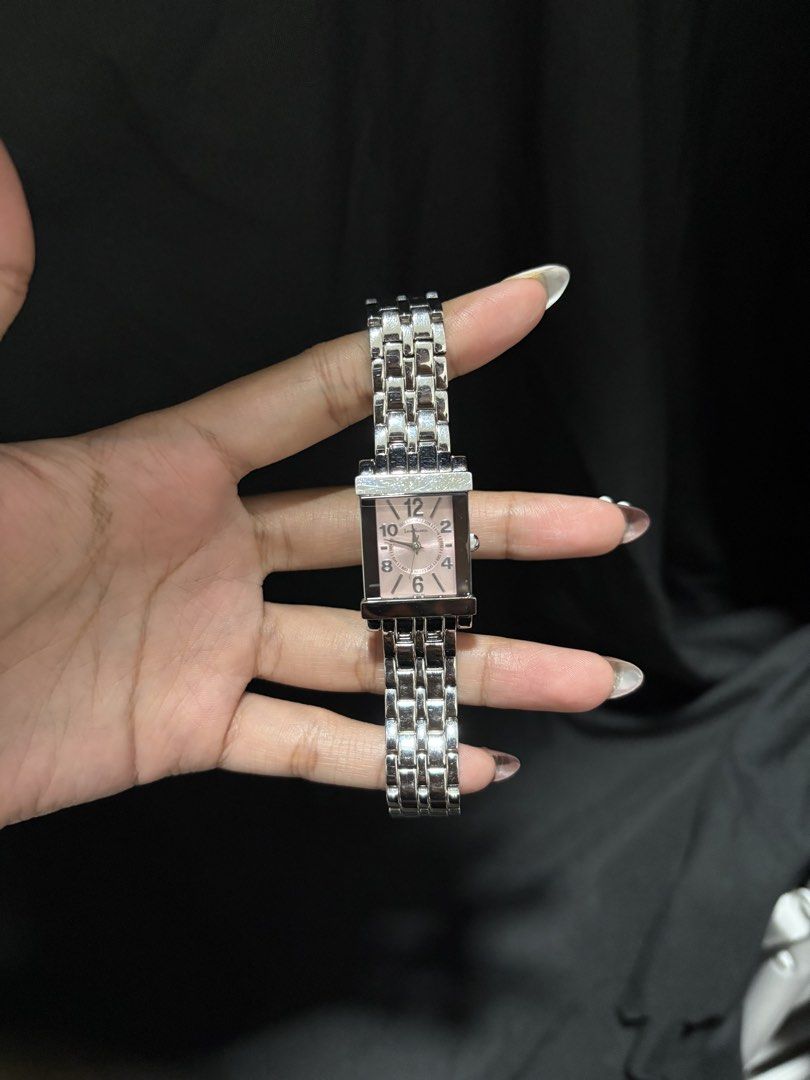 Legra Valencia Rectangular Pink Dial Silver Bracelet Watch (Category: Women's Watches) located in Caloocan City. Submitted by esnairahhh (Listing ID 1465378425, Image 2). Description: - Brand/Model: Legra Valencia wrist watch - Dial: Soft pink with even-number markers (12, 10, 8, 6, 4, 2) - Case: Rectangular with minor surface scuffs on the top metal bezel - Strap: Silver-tone link bracelet with secure clasp - Movement: Quartz (accurate timekeepi