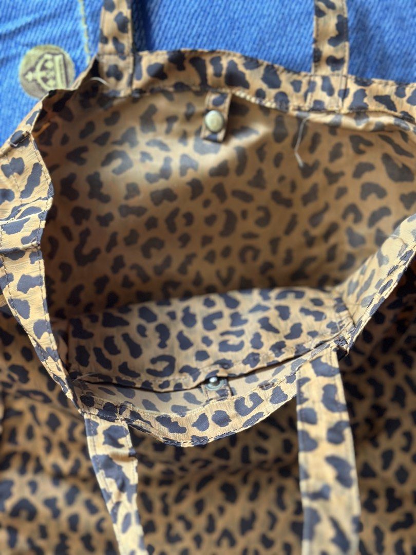 Leopard Print Tote Bag with Handles (Category: Tote Bags) located in Batangas. Submitted by enyahsnivl56498 (Listing ID 1465183690, Image 3). Description: - Trendy brown and black leopard print design - Features two comfortable top shoulder straps - Secure interior button snap closure - Stylish matching print interior lining - Lightweight and foldable for easy storage and travel.