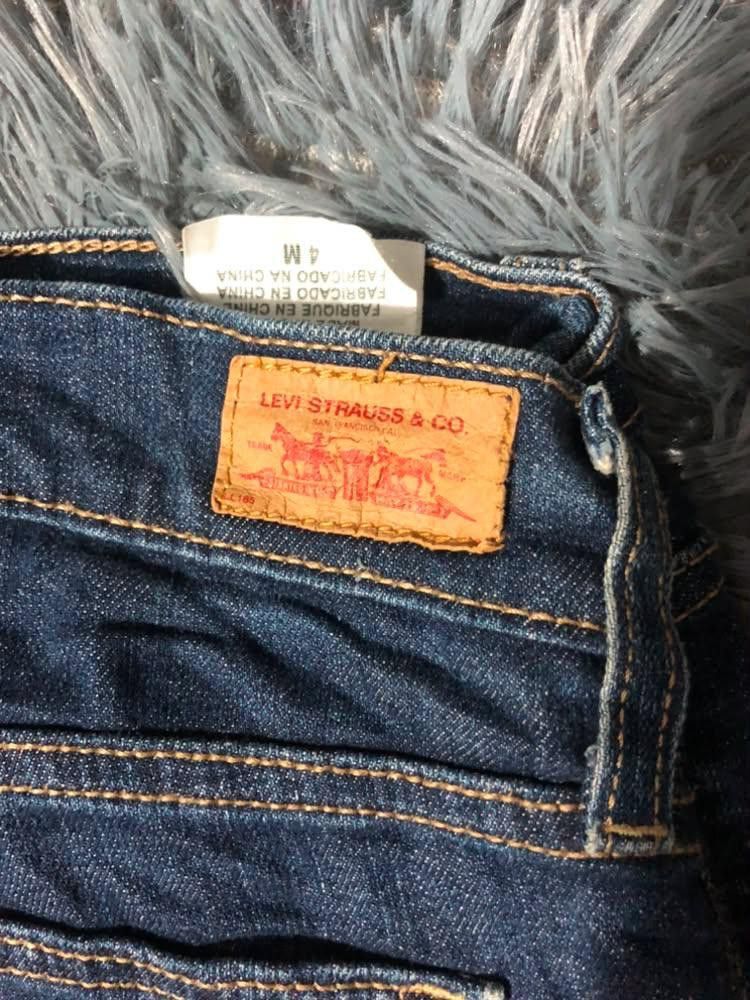 Levi Strauss & Co. Blue Jeans Size 4M (Category: Jeans) located in Malabon City. Submitted by matcha_frappe (Listing ID 1465296879, Image 2). Description: - Brand: Levi Strauss & Co. - Color/Wash: Dark blue denim - Size: Tag size 4M - Fit: Mid-rise with standard belt loops - Closure: Zip fly with button closure - Pockets: Classic 5-pocket design (2 front, 1 coin, 2 back patch with signature stitching) - Details: Genuine leather brand patch on bac