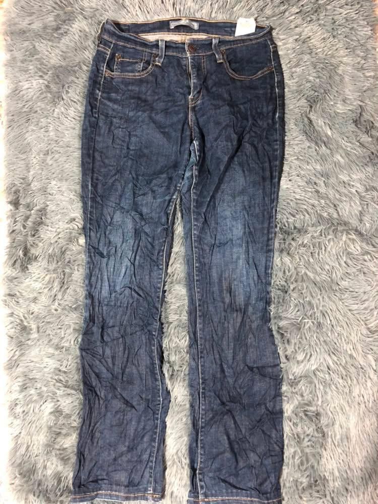 Levi Strauss & Co. Blue Jeans Size 4M (Category: Jeans) located in Malabon City. Submitted by matcha_frappe (Listing ID 1465296879, Image 1). Description: - Brand: Levi Strauss & Co. - Color/Wash: Dark blue denim - Size: Tag size 4M - Fit: Mid-rise with standard belt loops - Closure: Zip fly with button closure - Pockets: Classic 5-pocket design (2 front, 1 coin, 2 back patch with signature stitching) - Details: Genuine leather brand patch on bac