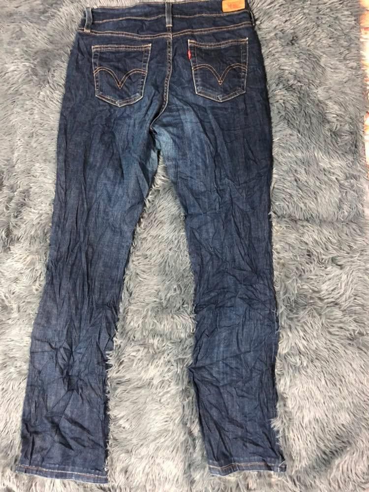 Levi Strauss & Co. Blue Jeans Size 4M (Category: Jeans) located in Malabon City. Submitted by matcha_frappe (Listing ID 1465296879, Image 3). Description: - Brand: Levi Strauss & Co. - Color/Wash: Dark blue denim - Size: Tag size 4M - Fit: Mid-rise with standard belt loops - Closure: Zip fly with button closure - Pockets: Classic 5-pocket design (2 front, 1 coin, 2 back patch with signature stitching) - Details: Genuine leather brand patch on bac