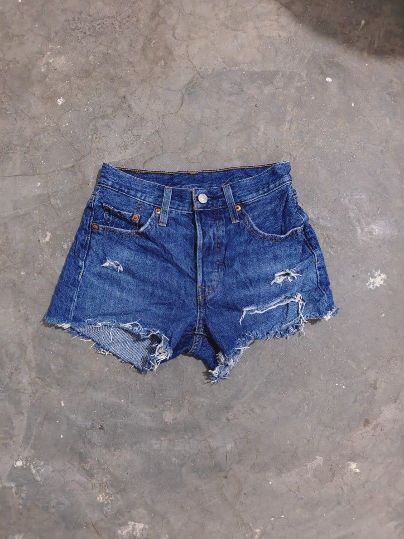 Levi's 501 Original Distressed Denim Shorts (Category: Shorts) located in Baliuag. Submitted by endiyos7 (Listing ID 1465295339, Image 1). Description: - Brand: Levi's 501 - Wash: Medium blue - Closure: Classic button fly with copper hardware - Style: Raw frayed hem with intentional distressing and rips - Details: Signature back patch and iconic red tab on the back pocket.
