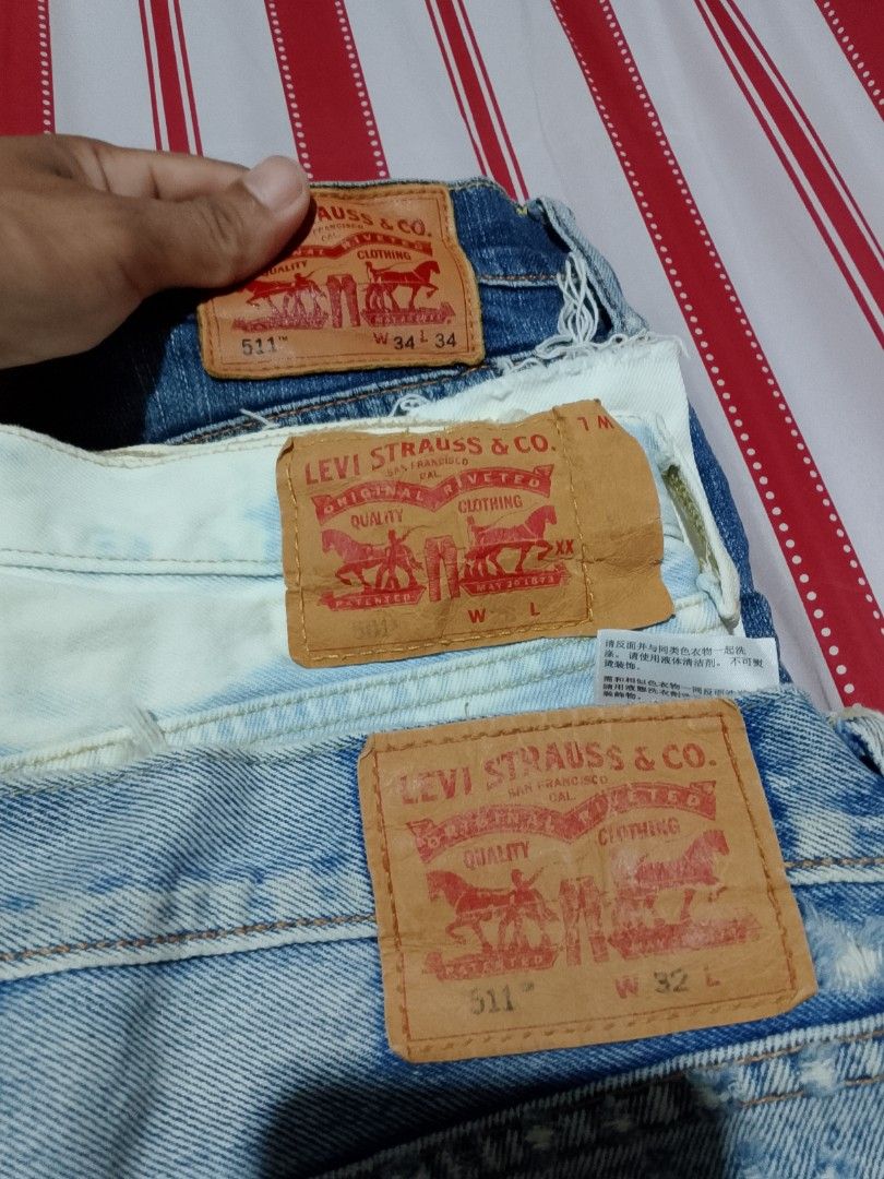 Levi's 511 Slim Fit Jeans Bundle Assorted Sizes Colors (Category: Jeans) located in Iloilo. Submitted by janillthrifted (Listing ID 1465312626, Image 3). Description: - Bundle of 4 Levi's jeans and pants - Colors: Light blue, dark blue, beige, and white distressed - Waist sizes range from W30 to W34 - Multiple versatile styles included in one great lot - Ready to ship, message for questions.