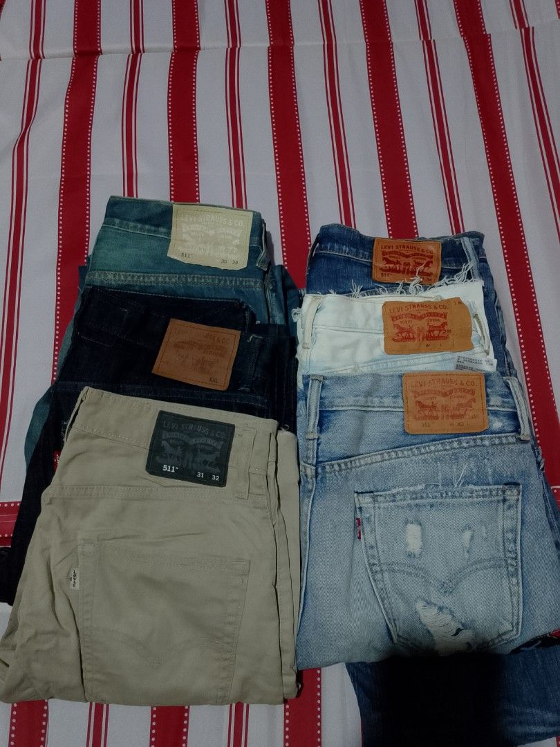 Levi's 511 Slim Fit Jeans Bundle Assorted Sizes Colors (Category: Jeans) located in Iloilo. Submitted by janillthrifted (Listing ID 1465312626, Image 1). Description: - Bundle of 4 Levi's jeans and pants - Colors: Light blue, dark blue, beige, and white distressed - Waist sizes range from W30 to W34 - Multiple versatile styles included in one great lot - Ready to ship, message for questions.