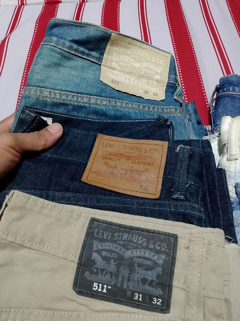 Levi's 511 Slim Fit Jeans Bundle Assorted Sizes Colors (Category: Jeans) located in Iloilo. Submitted by janillthrifted (Listing ID 1465312626, Image 2). Description: - Bundle of 4 Levi's jeans and pants - Colors: Light blue, dark blue, beige, and white distressed - Waist sizes range from W30 to W34 - Multiple versatile styles included in one great lot - Ready to ship, message for questions.