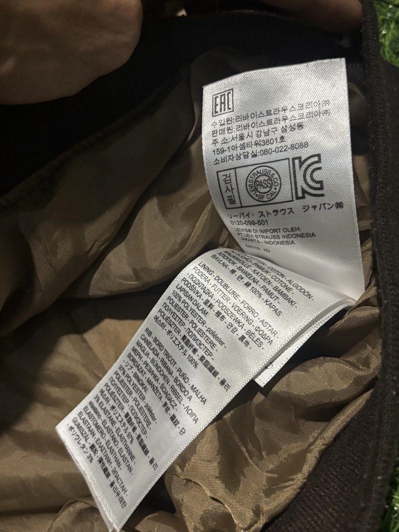 Levi's Camouflage Bomber Jacket Size XL (Category: Coats, Jackets and Outerwear) located in Manila. Submitted by kyosei00 (Listing ID 1465314131, Image 3). Description: - Brand: Levi's - Item: Camouflage Bomber Jacket - Size: XL - Origin: Made in Bangladesh - Closure: Full front zip - Details: Brown ribbed collar, cuffs, and hem, fully lined interior - Style: Utility aesthetic, perfect for everyday wear.