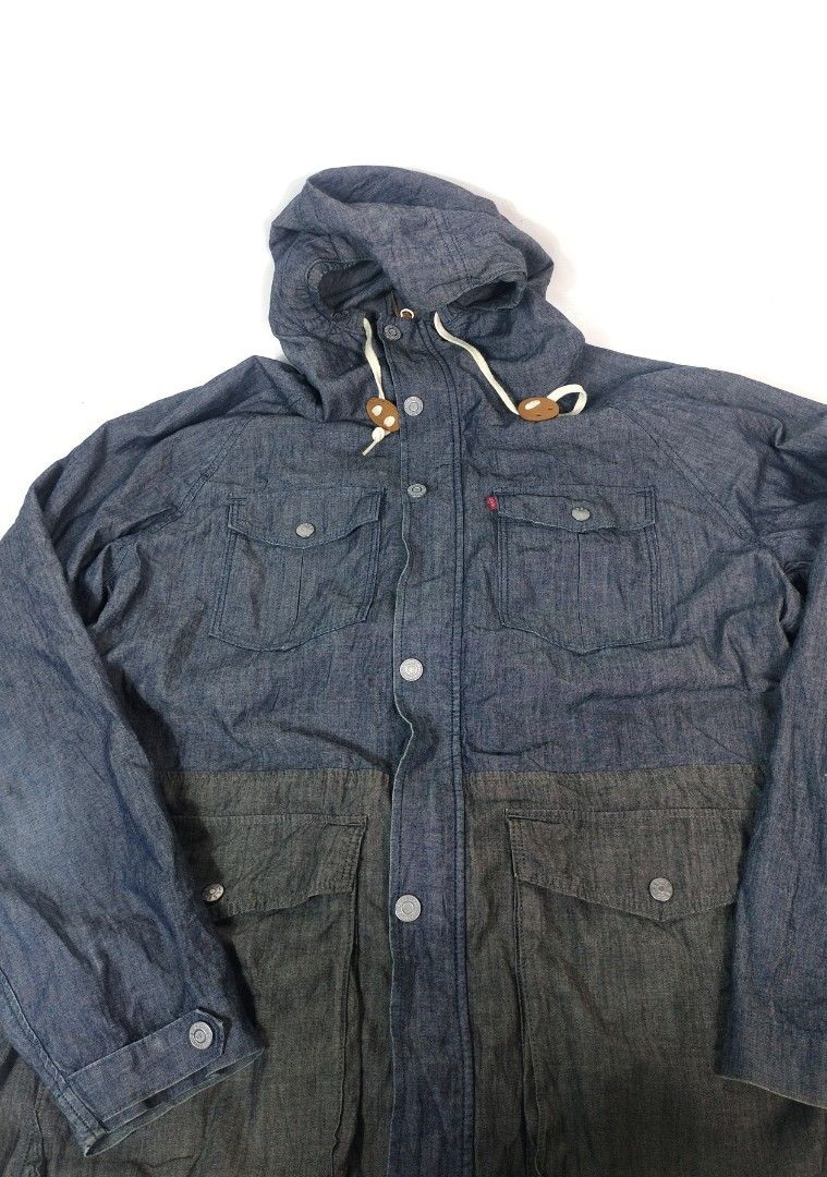 Levi's Two-Tone Denim Hooded Jacket (Category: Coats, Jackets and Outerwear) located in Manila. Submitted by callmetin (Listing ID 1465172407, Image 3). Description: Levis Denim SoftJacket Condition : Excellent Size : Large Dimension 👇 Chest : 22 Lenght : 29 Shoulder : 20 Sleeve : 25 - Brand: Levi's - Style: Two-tone color-blocked denim jacket (light and dark blue) - Hood: Drawstring hood with unique wooden-style toggles - Pockets: 4 front flap 