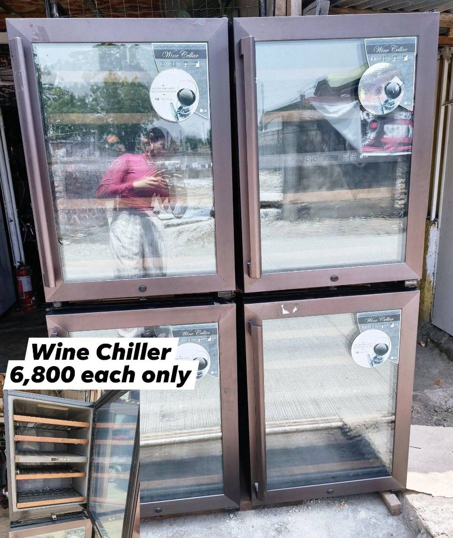 LG Wine Cellar Chiller Cabinet (Category: Wine Cellar & Storage) located in Lapu-Lapu City. Submitted by fiercebear.631182 (Listing ID 1465186281, Image 1). Description: Wine chiller unit available. Bronze-toned frame, glass door design. Wooden interior shelves inside. Digital temperature control panel on the rack. Several units currently in stock. Priced individually per piece. Pick-up preferred due to weight..