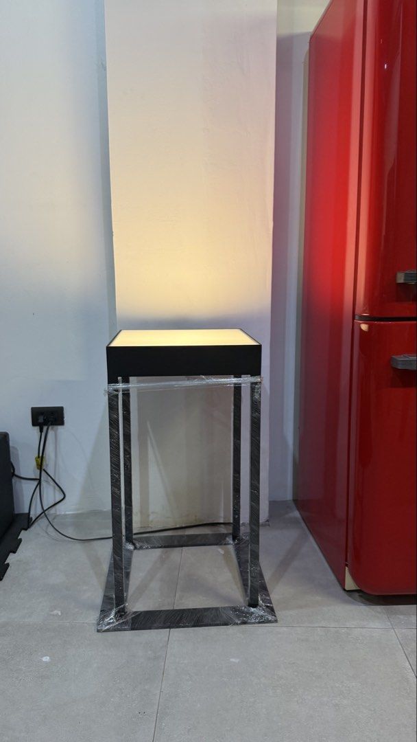 Light up display plinth pedestal stand (Category: Office Furniture & Fixtures) located in Pasay City. Submitted by bri_bayona (Listing ID 1465319021, Image 3). Description: Custom Sculpture / Collection Stand - Sleek modern design: Perfect for contemporary retail spaces and exhibition booths - 4 color lighting: Illuminated tempered glass top surface with a built-in internal LED panel for even glow - Sturdy build: Durable matte black metal frame -