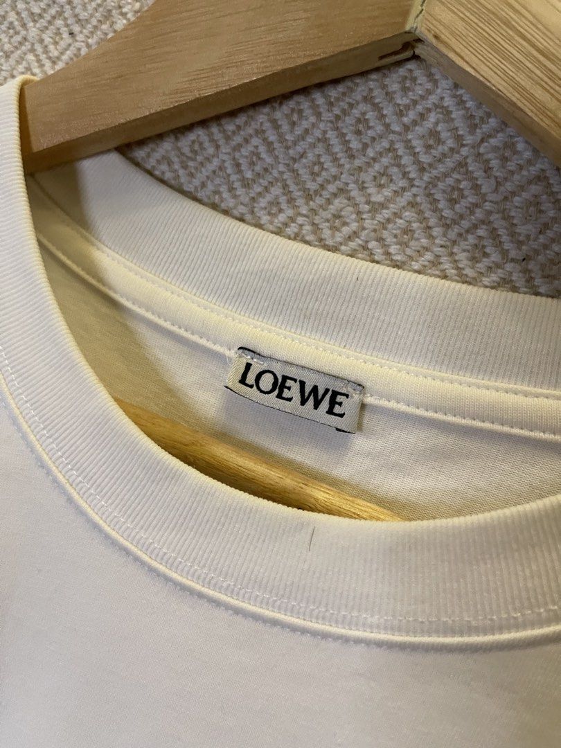 Loewe floral tee (Category: Tshirts & Polo Shirts ) located in Manila. Submitted by hypestock_mnl (Listing ID 1465195781, Image 3). Description: - stylish - perfect for casual wear - great fit - in good condition - minimal signs of usage - 9/10 - money worth! - see pics for details/issue.