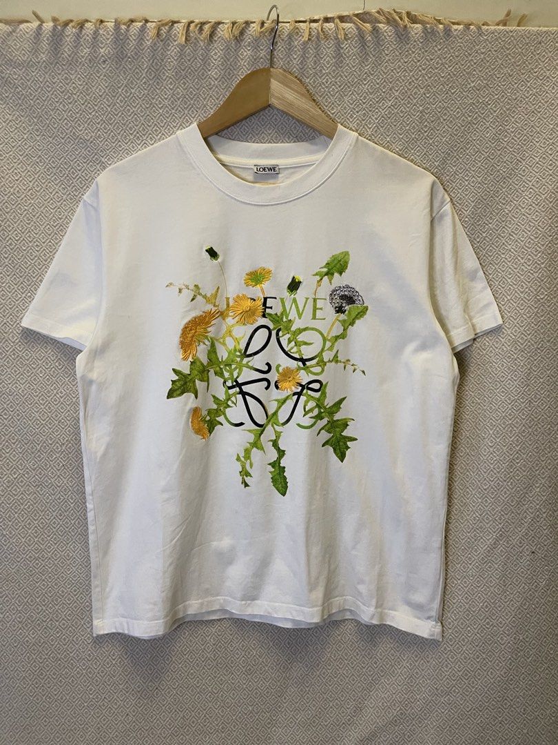 Loewe floral tee (Category: Tshirts & Polo Shirts ) located in Manila. Submitted by hypestock_mnl (Listing ID 1465195781, Image 1). Description: - stylish - perfect for casual wear - great fit - in good condition - minimal signs of usage - 9/10 - money worth! - see pics for details/issue.