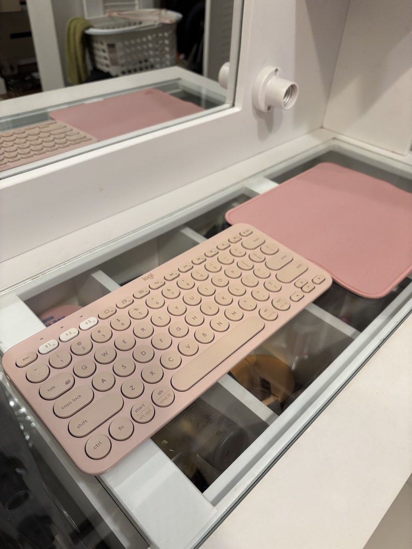 Logitech K380 Bluetooth Keyboard Rose Pink and Mouse pad (Category: Computer Keyboard) located in Taguig. Submitted by mommae_preloved (Listing ID 1465338753, Image 1). Description: Take both! - Model: Logitech K380 Wireless Keyboard - Color: Rose Pink (clean and tidy condition) - Features: Compact layout with cute round keys - Connectivity: Easy Bluetooth pairing across multiple devices - Power: Standard AAA battery setup - Freebie: Includes mat