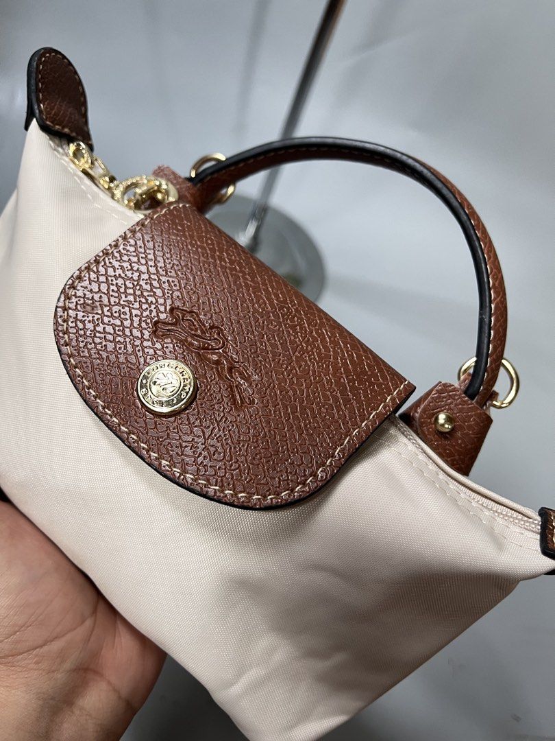 Longchamp micro (Category: Luxury Accessories) located in San Jacinto. Submitted by kellysthrift_ (Listing ID 1465264447, Image 2). Description: Longchamp micro paper white.
