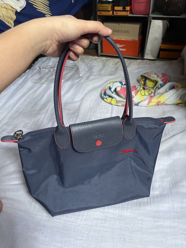 Longchamp tote bag navy blue (Category: Luxury Accessories) located in San Jacinto. Submitted by kellysthrift_ (Listing ID 1465265102, Image 1). Description: Micro Tote bag.