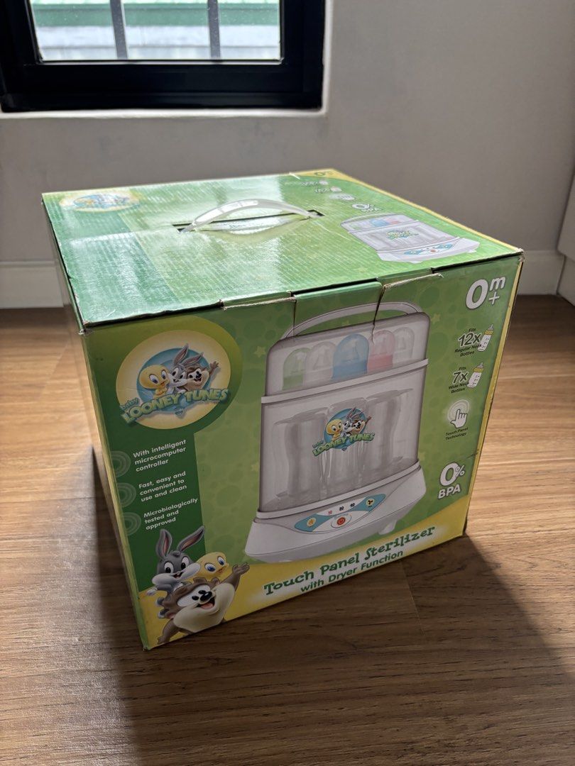 Looney Tunes Sterilizer with Dryer (Category: Breastfeeding & Bottle Feeding) located in Quezon City. Submitted by chanelmonster (Listing ID 1465183791, Image 1). Description: - Authentic Looney Tunes baby bottle sterilizer and dryer - Easy-to-use touch panel operation with auto timer and auto shut-off function - Generous capacity: fits 12 regular bottles or 7 wide-neck bottles - 100% BPA-free for your baby's safety - Condition: Brand new, box op