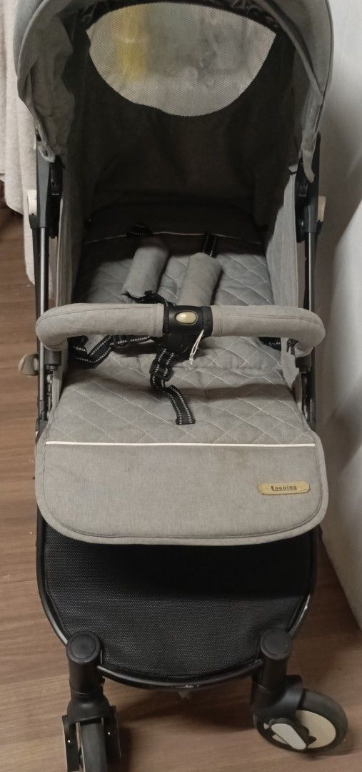Looping Squizz Stroller Grey (Category: Strollers) located in Pasay City. Submitted by joanirishb86535 (Listing ID 1465248759, Image 2). Description: - Brand/Model: Looping Squizz Stroller in stylish grey - Comfort & Style: Features a cozy quilted seat pad and matching canopy with a mesh peekaboo window - Safety & Convenience: Equipped with a bumper bar, 5-point safety harness with padded shoulder straps, and a roomy under-seat storage basket - P