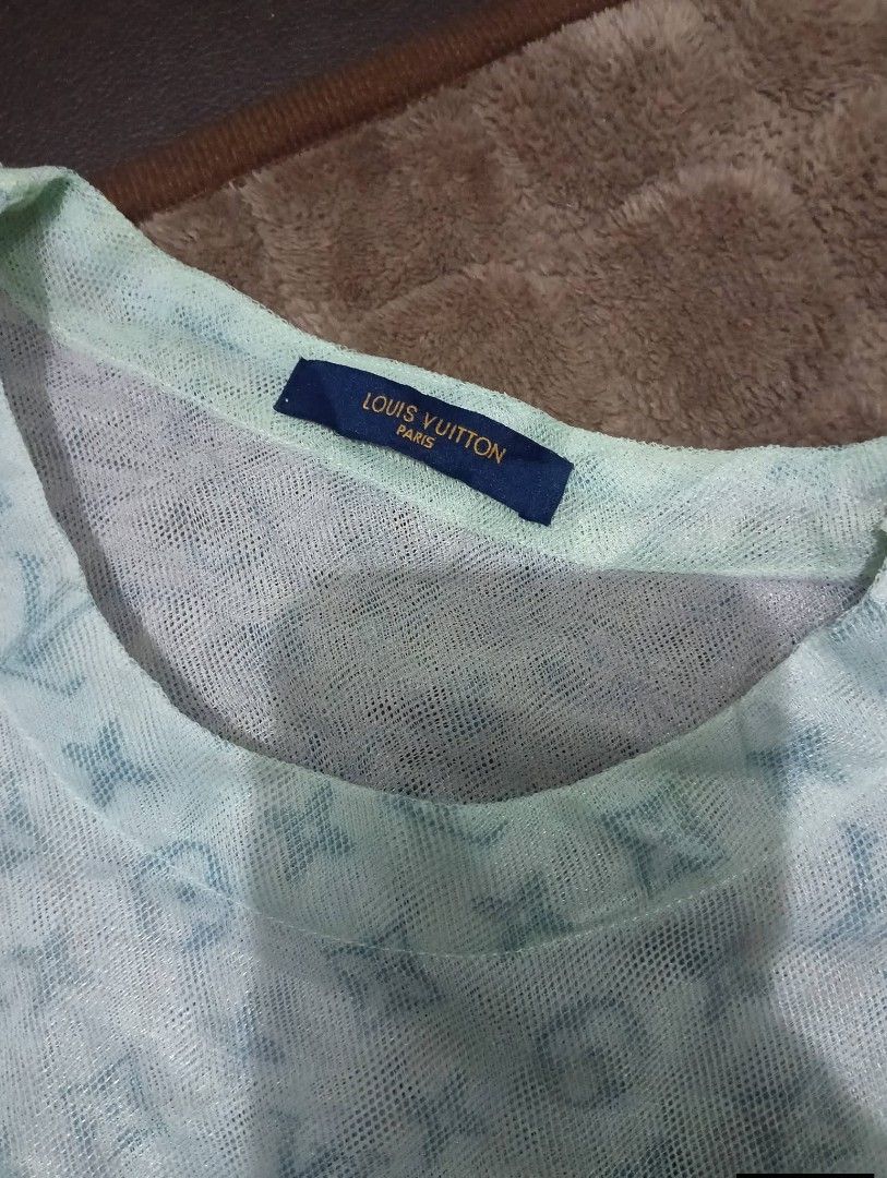 Louis Vuitton 20SS Monogram Tulle Tee Light Blue (Category: Luxury Apparel) located in Odiongan. Submitted by thrifthub_bundang07 (Listing ID 1465378213, Image 3). Description: - Brand: Louis Vuitton (20SS) - Style: Monogram Tulle T-Shirt - Color: Light blue with pastel undertones - Material: Sheer mesh fabric with all-over LV monogram - Details: Layered hem and cuff detailing, classic crew neckline - Condition: Rare streetwear find, well-maintai