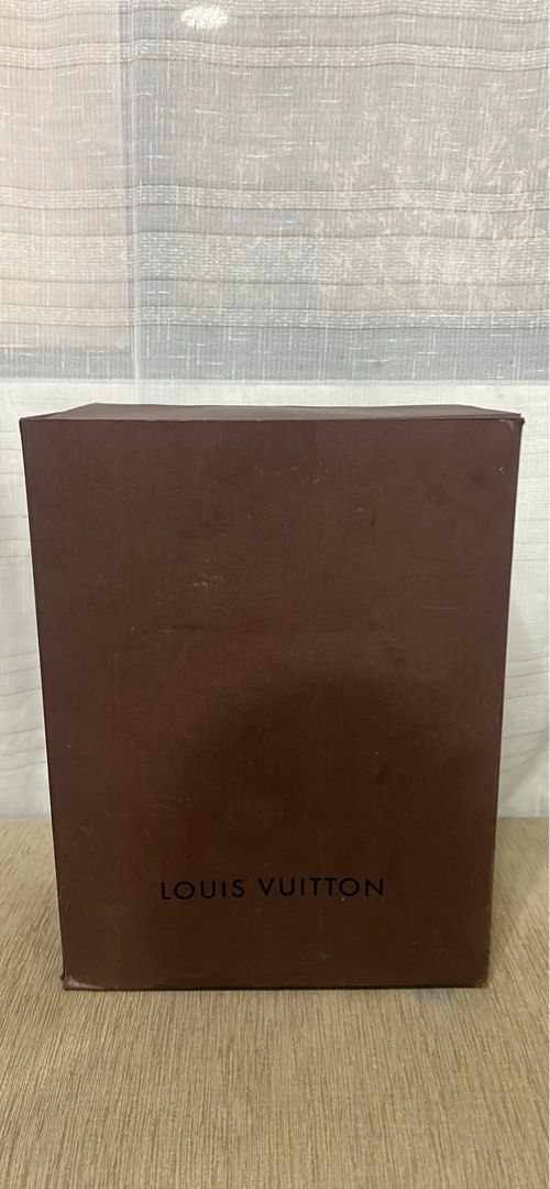 Louis Vuitton Brown Paper Box Packaging (Category: Luxury Bags & Wallets) located in Manila. Submitted by brownqueen65310 (Listing ID 1465207040, Image 1). Description: Louis Vuitton Brown Paper Box Packaging - 100% Authentic Louis Vuitton brown paper box from a LV Noe - Dimensions: 13in x 10in x 18in - Tall rectangular design with classic black branding and hinged lid - Features stamped codes underneath: 412253 006 D61404 (Made in China) Conditi
