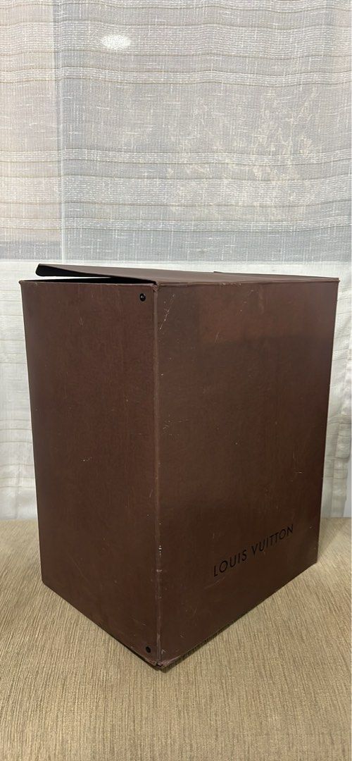 Louis Vuitton Brown Paper Box Packaging (Category: Luxury Bags & Wallets) located in Manila. Submitted by brownqueen65310 (Listing ID 1465207040, Image 3). Description: Louis Vuitton Brown Paper Box Packaging - 100% Authentic Louis Vuitton brown paper box from a LV Noe - Dimensions: 13in x 10in x 18in - Tall rectangular design with classic black branding and hinged lid - Features stamped codes underneath: 412253 006 D61404 (Made in China) Conditi