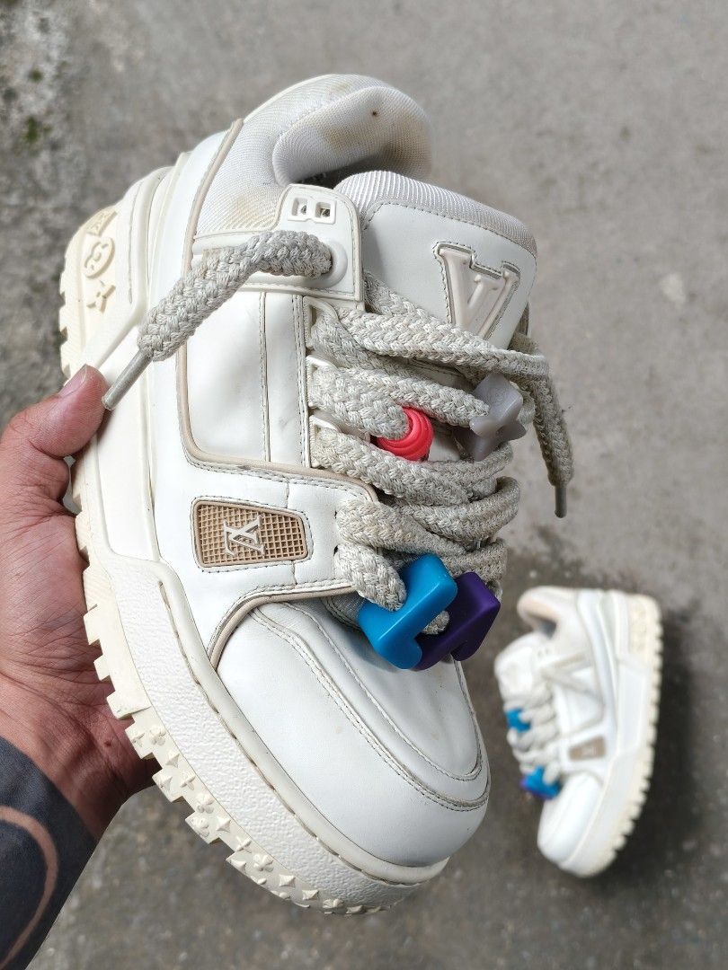 Louis Vuitton maxi Trainer white (Category: Sneakers) located in Manila. Submitted by kushoenero (Listing ID 1465301145, Image 1). Description: Louis Vuitton skate sneakers in cream and white. Chunky rope laces with colorful flower charms attached. Monogram pattern on the thick rubber outsoles. Interior lining features the classic LV monogram pattern all over. Leather upper with perforated details on the side panels. Made in Italy..