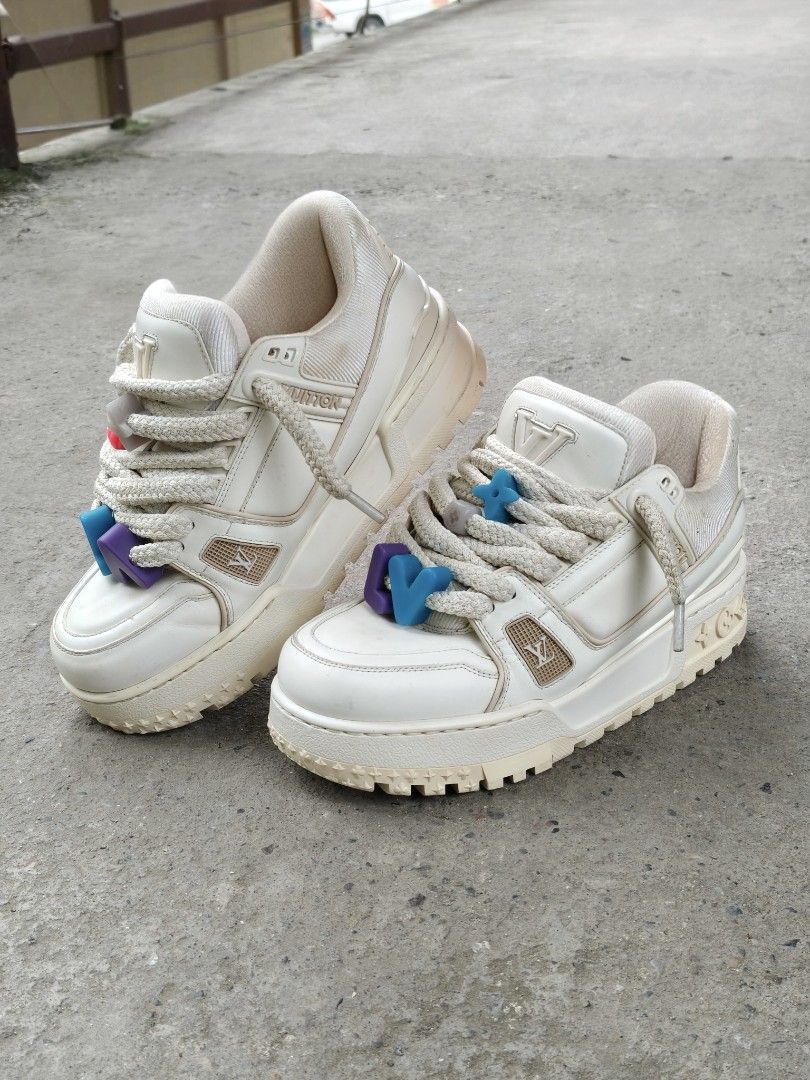 Louis Vuitton maxi Trainer white (Category: Sneakers) located in Manila. Submitted by kushoenero (Listing ID 1465301145, Image 2). Description: Louis Vuitton skate sneakers in cream and white. Chunky rope laces with colorful flower charms attached. Monogram pattern on the thick rubber outsoles. Interior lining features the classic LV monogram pattern all over. Leather upper with perforated details on the side panels. Made in Italy..