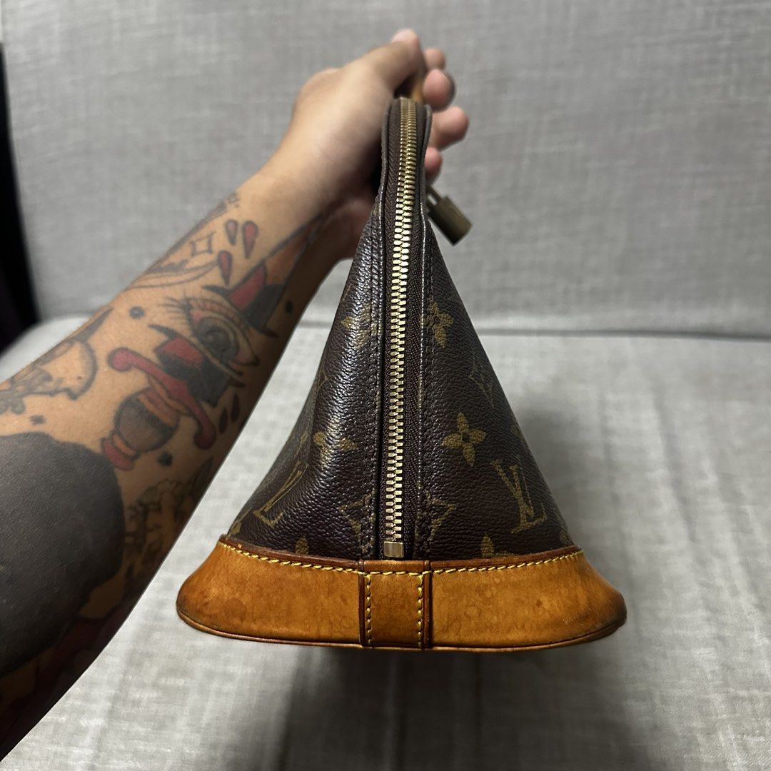 Louis Vuitton Monogram Alma Handbag (Category: Luxury Bags & Wallets) located in Quezon City. Submitted by retroboominwantsummoh (Listing ID 1465338580, Image 3). Description: - Authentic Louis Vuitton Monogram Canvas Handbag - Classic brown coated canvas with signature Monogram print - Vachetta leather base trim and dual rolled top handles with a beautiful natural patina - Secure top zip closure with attached padlock detail on the front handle -