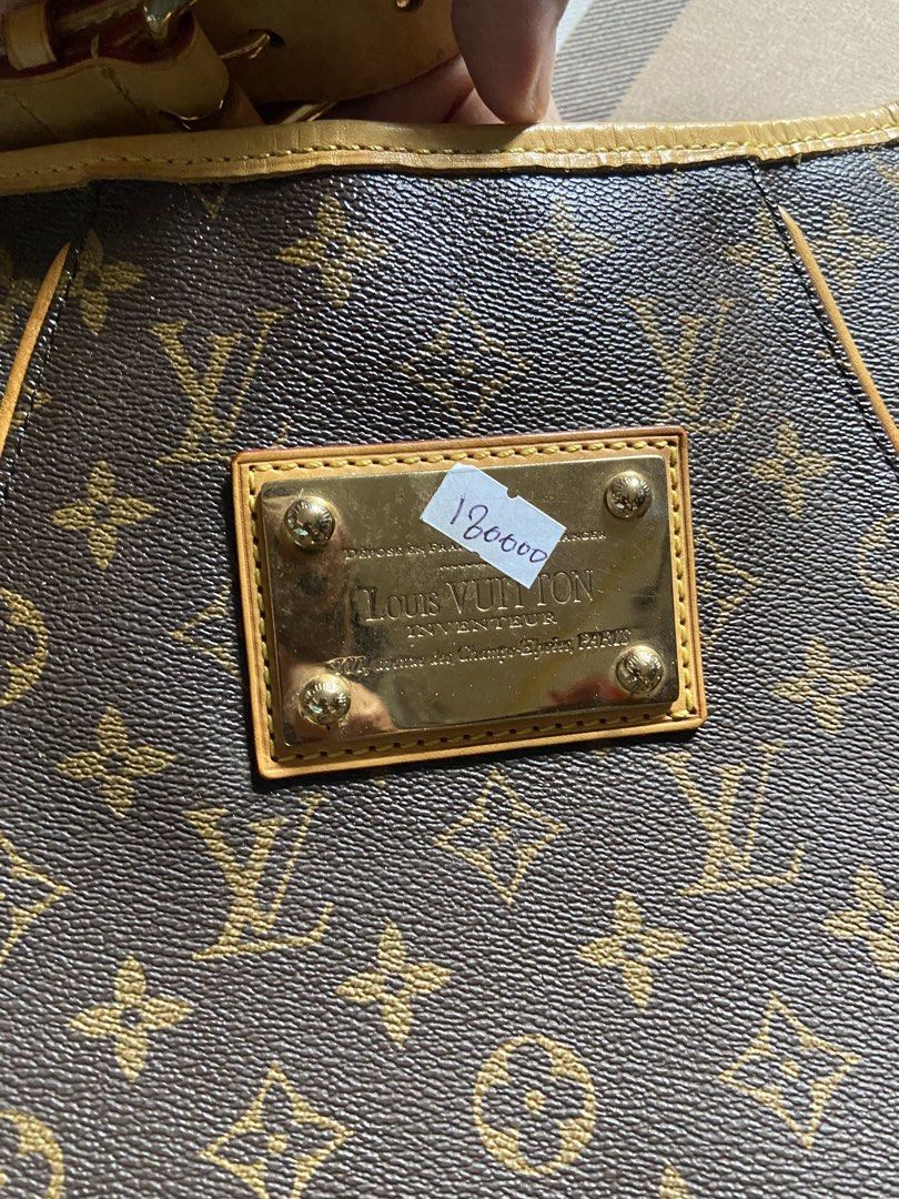 Louis Vuitton Monogram Canvas Hobo Handbag (Category: Luxury Bags & Wallets) located in Calamba. Submitted by mj_sotto22 (Listing ID 1465225843, Image 3). Description: Classic Monogram canvas with vachetta leather trim. Gold-tone metal Louis Vuitton Inventeur plaque on the front. Adjustable shoulder strap with buckle hardware. Spacious interior lined with fabric. Structured slouchy hobo silhouette with reinforced corners and gold feet at the bott