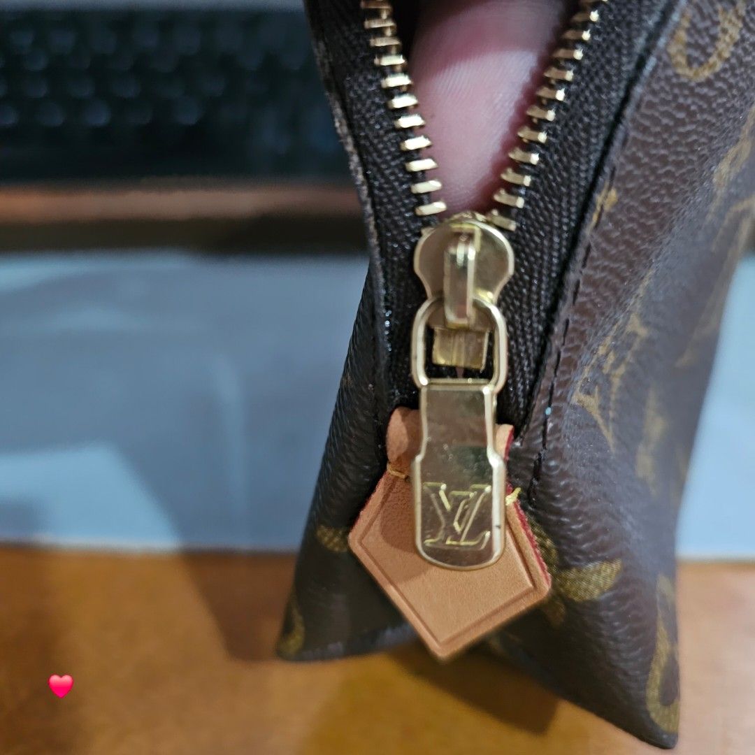 Louis Vuitton Monogram Canvas Cosmetics Pouch (Category: Luxury Bags & Wallets) located in Batangas. Submitted by iammrs (Listing ID 1465259469, Image 2). Description: - Brand: Louis Vuitton - Style: Monogram Cosmetic Pouch - Color: Classic Brown - Hardware: Gold-tone zipper with leather pull tab - Interior: Clean cream lining, stamped Louis Vuitton Paris Made in Spain - Condition/Feature: Structured shape, keeps everyday essentials organized ran