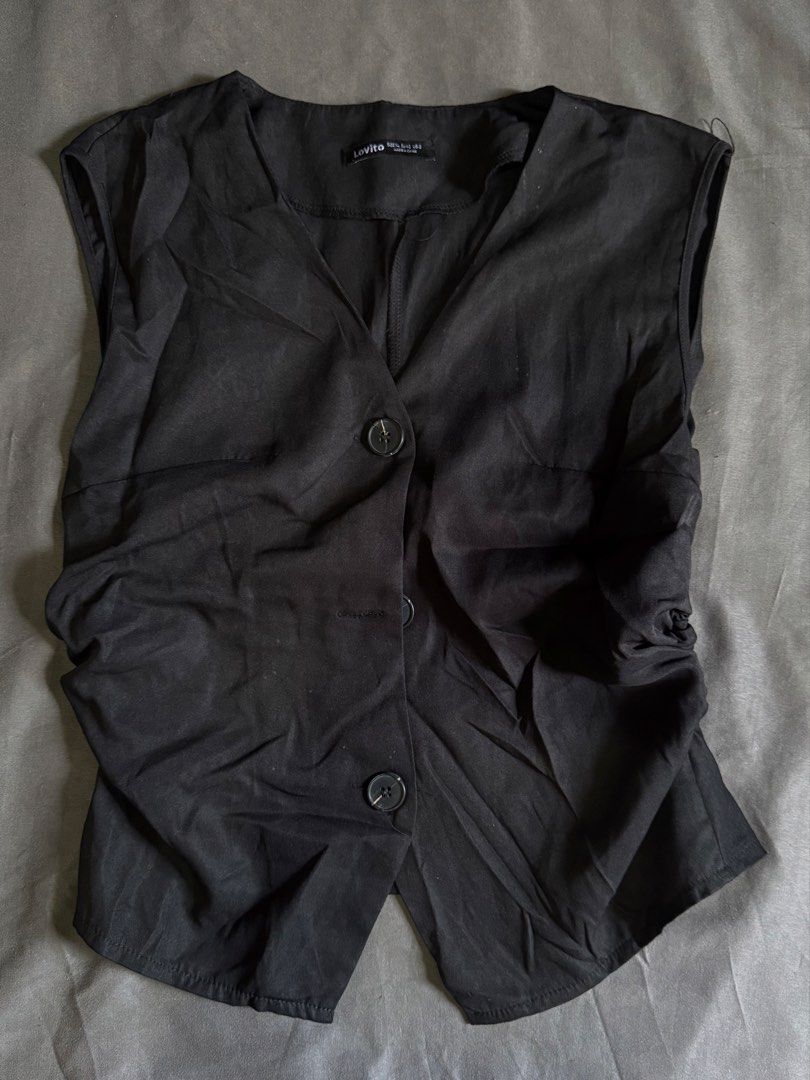 Lovito Black Button-Up Sleeveless Vest (Category: Sleeveless) located in Bulacan. Submitted by jyrshsh (Listing ID 1465204812, Image 1). Description: .ᐟsize: XL (but best fit for med size) .ᐟcolor: black .ᐟstyle: v-neck sleeveless vest with front button closure (3 dark buttons) and gathered side details .ᐟcondition: Great for layering casual or smart outfits mop: gcash mod: lbc/jnt loc: bulacan.