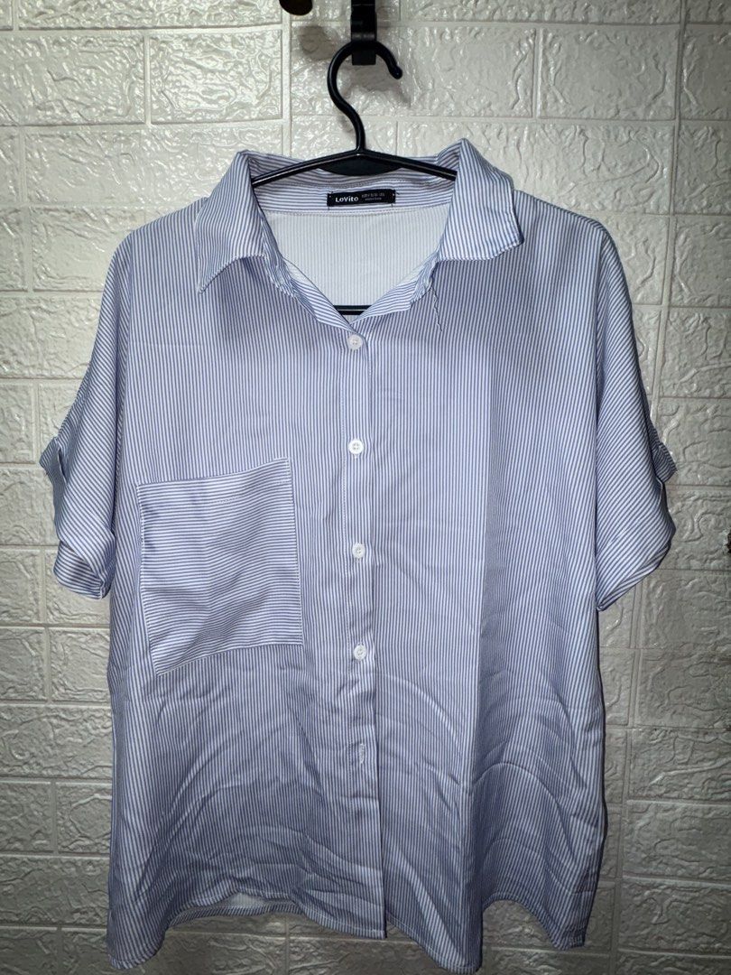Lovito Blue White Striped Button Up Shirt Size M (Category: Tshirts & Polo Shirts ) located in Makati City. Submitted by justtinabelles (Listing ID 1465212802, Image 1). Description: - Brand: Lovito - Design: Blue and white vertical stripes - Fit: Relaxed fit, Size M (EU 36, US 6) - Details: Short sleeves with folded cuffs, pointed collar, front button closure, and single chest pocket - Material: Lightweight - Condition: Clean and ready to wear.