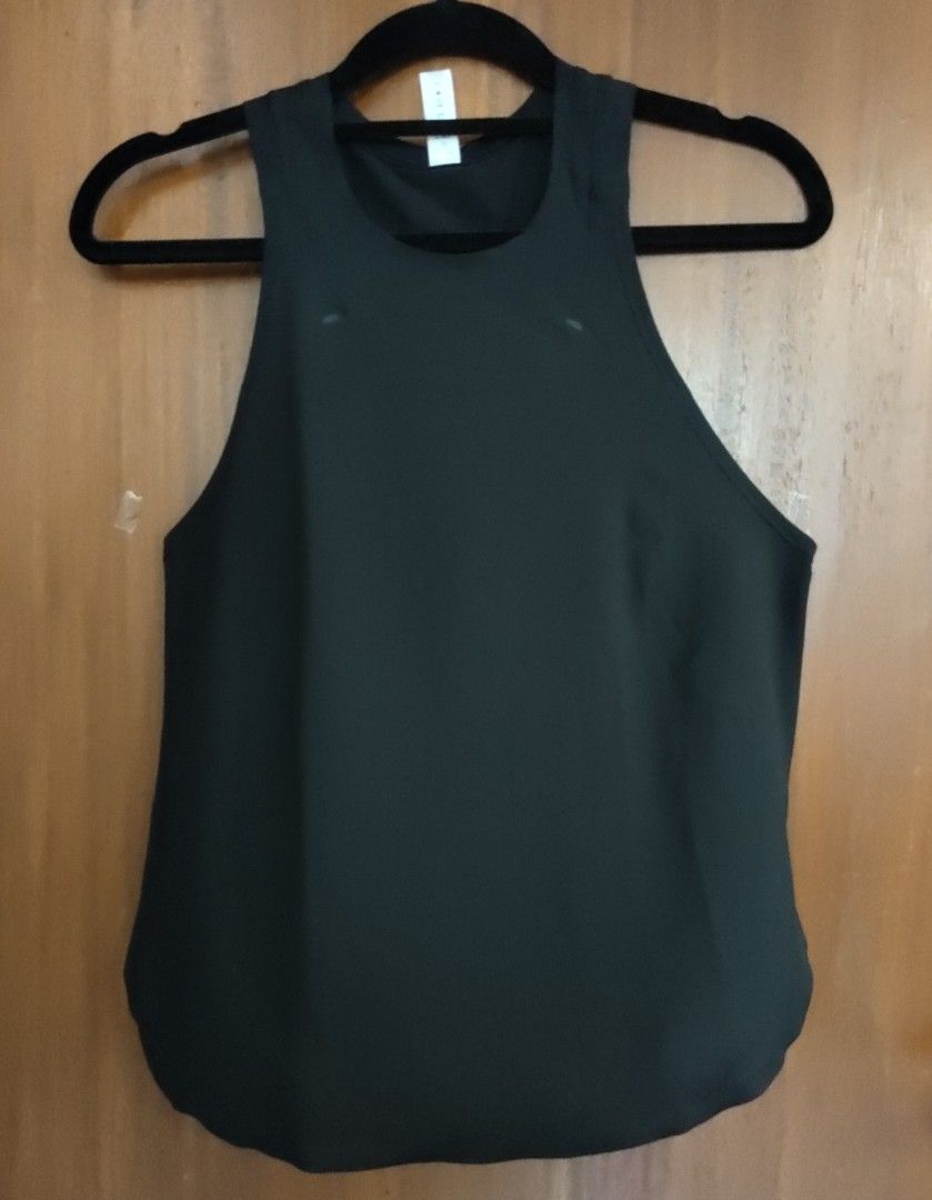Lululemon Black High Neck Tank Top Size 4 (Category: Activewear) located in Muntinlupa City. Submitted by cezzy82 (Listing ID 1465230066, Image 1). Description: - Brand: Lululemon - Size: 4 - Color: Black - Style: High neck, racerback with curved hem - Material: 91% polyester, 9% Lycra elastane - Features: Small reflective logo on lower back, super breathable - Condition: Great workout top.