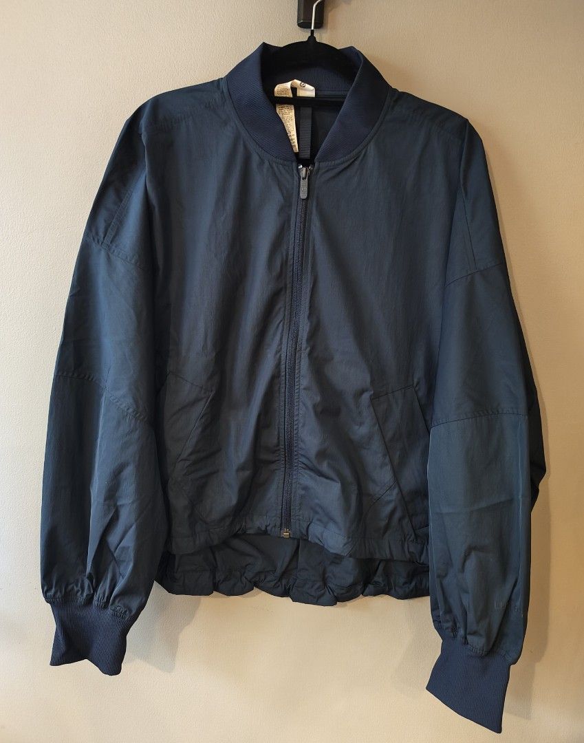 Lululemon Bomber Jacket Navy Blue Size XS (Category: Activewear) located in Muntinlupa City. Submitted by cezzy82 (Listing ID 1465230465, Image 1). Description: - Brand: Lululemon (Designed in Vancouver) - Color: Navy Blue - Size: XS (relaxed fit) - Material: Polyester and recycled nylon blend - Closure: Full front zipper - Details: Ribbed collar, cuffs, and hem, plus two front hand pockets - Style: Lightweight outerwear, perfect for activewear o
