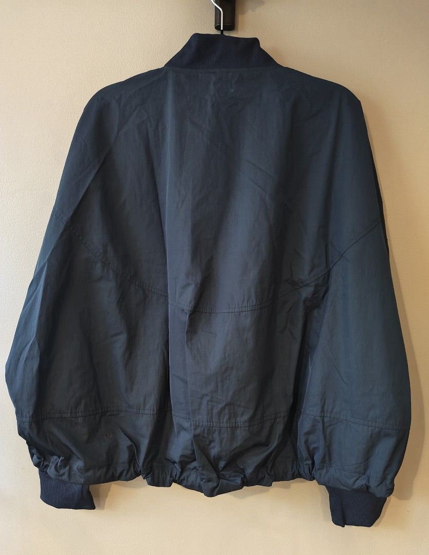 Lululemon Bomber Jacket Navy Blue Size XS (Category: Activewear) located in Muntinlupa City. Submitted by cezzy82 (Listing ID 1465230465, Image 2). Description: - Brand: Lululemon (Designed in Vancouver) - Color: Navy Blue - Size: XS (relaxed fit) - Material: Polyester and recycled nylon blend - Closure: Full front zipper - Details: Ribbed collar, cuffs, and hem, plus two front hand pockets - Style: Lightweight outerwear, perfect for activewear o