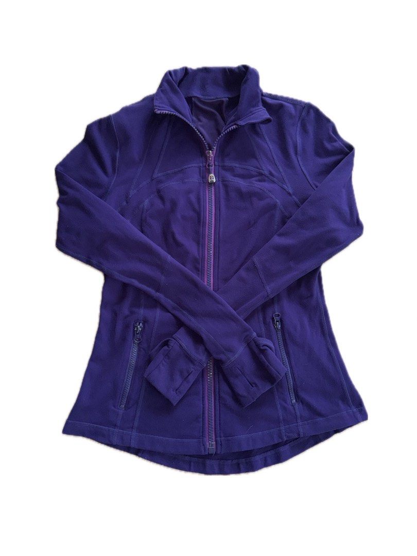 Lululemon Define Jacket Purple Size 8 (Category: Coats, Jackets and Outerwear) located in Teresa. Submitted by boanerjes (Listing ID 1465211581, Image 1). Description: - Brand: Lululemon - Color: Deep Purple - Size: 8 - Features: Thumbholes, front zipper pockets, signature silver logo zipper pull and back neck logo - Fit: Snug and flattering, perfect for workouts - Condition: Good, with minor lint fibers on the fabric Negotiable .