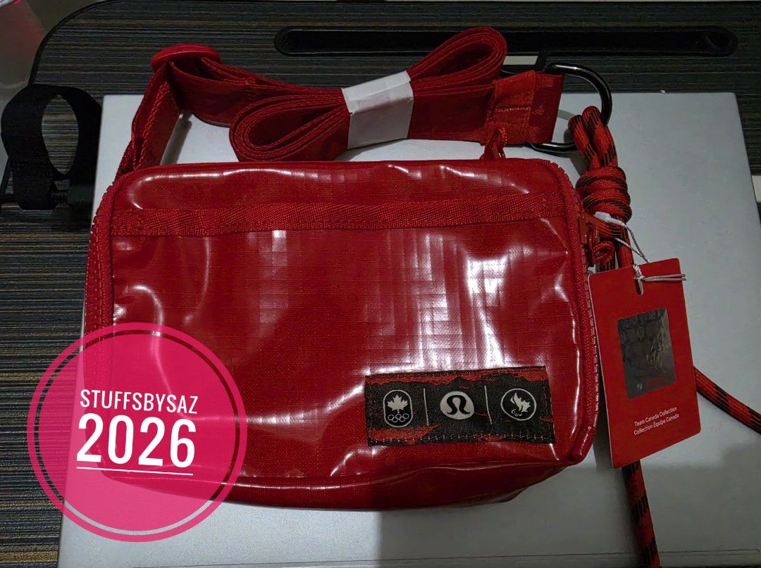 AUTHENTIC lululemon Team Canada Collection Red Crossbody Bag (Category: Cross-body Bags) located in Calamba. Submitted by stuffsbysaz (Listing ID 1465328658, Image 1). Description: [ ] Brand/Collaboration: Lululemon x Team Canada (Official Olympic & Paralympic collaboration). [ ] Capacity: 1.5 Liters. [ ] Dimensions: Approximately 6.9" x 2" x 4.9" (17.5cm x 5cm x 12.5cm). [ ] Material: Crafted from a lightweight, durable, and water-repellent rips