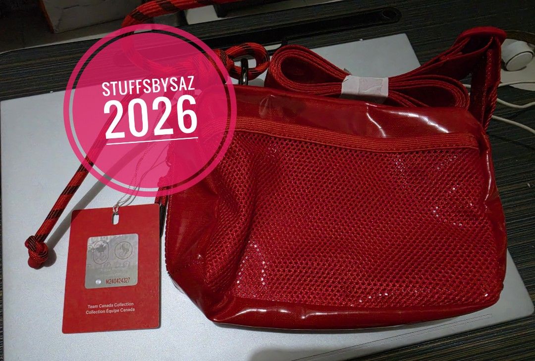 AUTHENTIC lululemon Team Canada Collection Red Crossbody Bag (Category: Cross-body Bags) located in Calamba. Submitted by stuffsbysaz (Listing ID 1465328658, Image 2). Description: [ ] Brand/Collaboration: Lululemon x Team Canada (Official Olympic & Paralympic collaboration). [ ] Capacity: 1.5 Liters. [ ] Dimensions: Approximately 6.9" x 2" x 4.9" (17.5cm x 5cm x 12.5cm). [ ] Material: Crafted from a lightweight, durable, and water-repellent rips