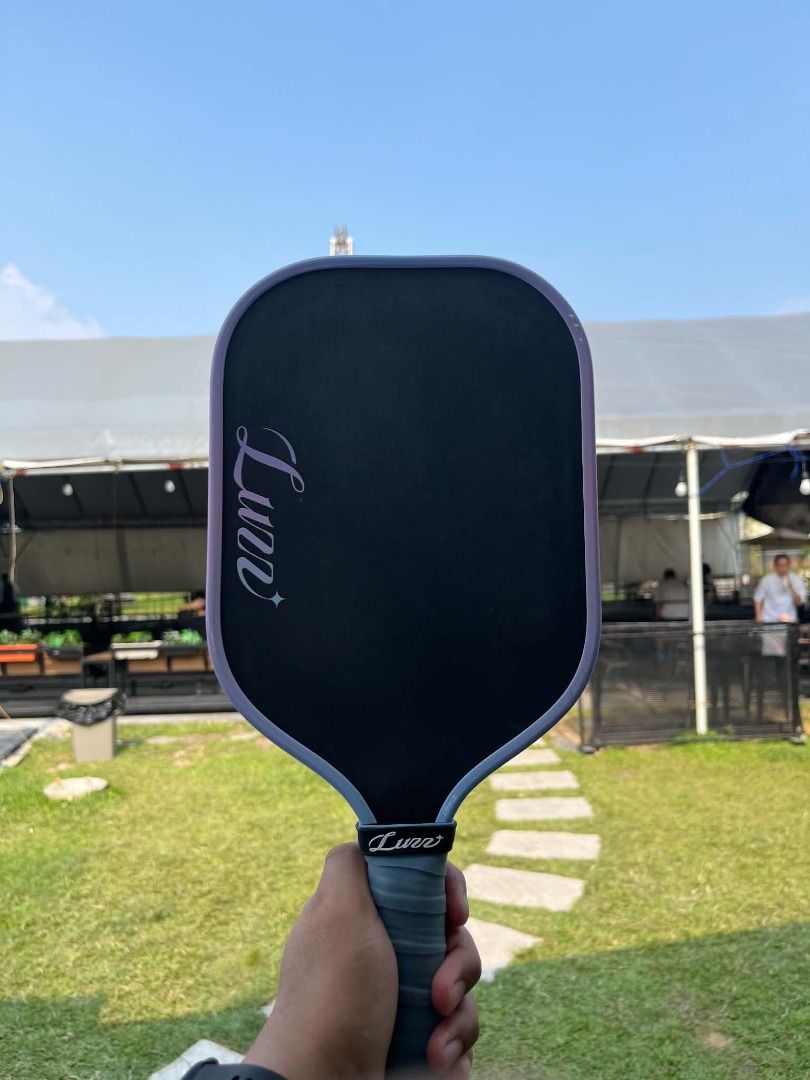 Luzz pickleball Paddle Pro 4 Tornazo (Category: Racket and Ball Sports) located in Bacoor. Submitted by unclejuu (Listing ID 1465240241, Image 2). Description: Brand: Luzz Model: Pickleball Paddle Pro 4 Tornazo Color: Black with purple accents and trim Used only for content. 1 week old. .