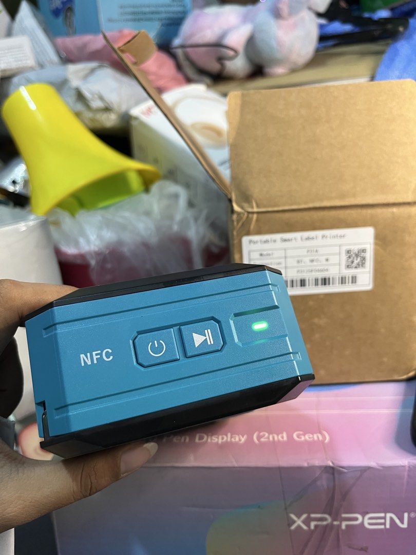 MakeID P31A Portable Smart Label Printer (Category: Printers, Scanners & Copiers) located in Manila. Submitted by abbigail029. (Listing ID 1465200644, Image 2). Description: - Brand: MakeID P31A portable smart label printer - Connectivity: Bluetooth and NFC for easy phone pairing - Inclusions: Comes with original brown cardboard box - Ideal Use: Perfect for organizing cables, storage bins, and office supplies quickly.