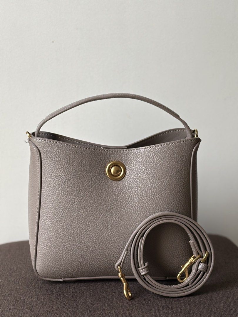 MANGO Bucket Bag | Taupe Handbag (Category: Shoulder Bags) located in Manila. Submitted by thecloseteditph (Listing ID 1465256118, Image 1). Description: • Authentic MANGO • Taupe color • Bucket bag design • Gold-tone metal detail • Short handle • Detachable & adjustable long strap • Interior zip pocket • Clean and well-maintained • Excellent pre-owned condition • No major flaws 📌 Bag + long strap included 📌 Selling because no longer used..