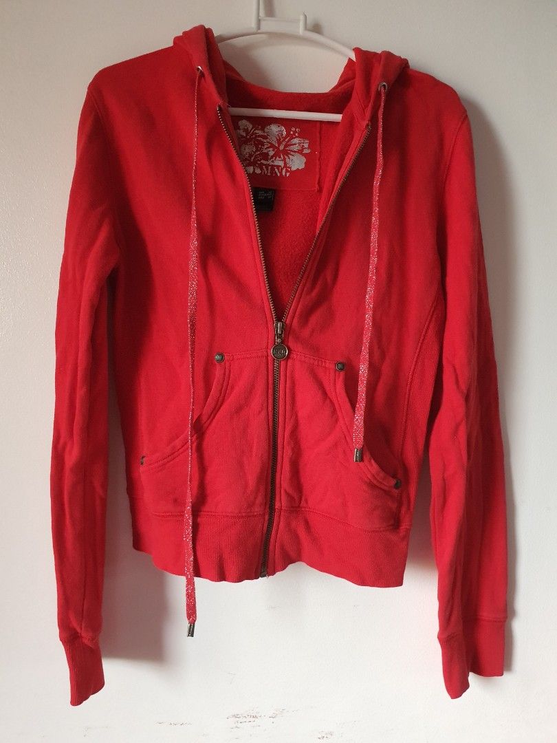 MANGO Red Zip Hoodie Size XS (Category: Coats, Jackets and Outerwear) located in Meycauayan. Submitted by shoptoown (Listing ID 1465176124, Image 1). Description: - Brand: MNG - Size: XS - Color: Bright red - Features: Sparkly silver drawstrings, custom MNG metal zipper pull, and soft brushed fleece lining - Pockets: Two front pockets - Details: Ribbed cuffs and hem with a white floral graphic print on the inside back neck - Condition: Great casu