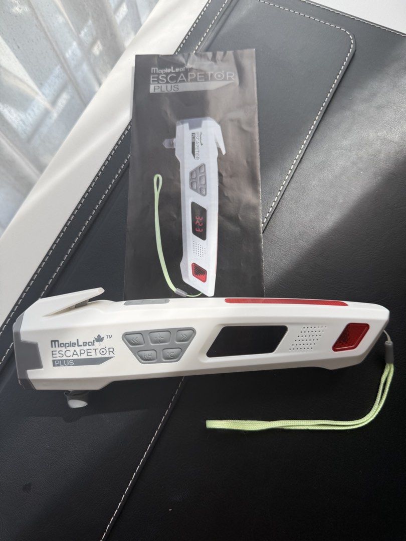 MapleLeaf Escapetor Plus Multi-function Emergency Tool (Category: Emergency Tools) located in Singapore. Submitted by EagleBird (Listing ID 1465235891, Image 1). Description: Multipurpose survival and safety device. Built-in LED lighting, glass breaker, alarm clock, thermometer, hand crank dynamo, strap cutter, and flash lighting. Includes instruction manual and original white box with icons detailing each function. Lightweight white casing with 