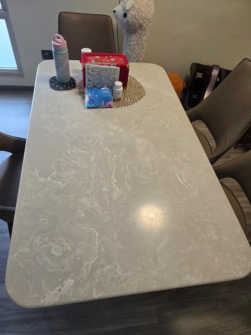 Marble pattern dining table set (Category: Tables & Sets) located in Singapore. Submitted by jojo123456 (Listing ID 1465176620, Image 3). Description: - Set includes: 1 rectangular dining table - Table: White marble-patterned top with a sturdy black metal pedestal base and elegant veining - Design: Sleek, modern style ideal for dining rooms or kitchen spaces - Condition: Excellent, ready for immediate use.