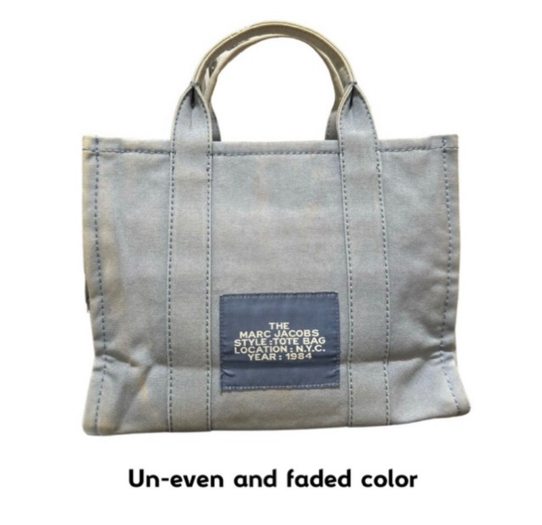 Marc Jacobs The Tote Bag Canvas (Category: Tote Bags) located in Digos. Submitted by tindahannimaria (Listing ID 1465268182, Image 2). Description: - Brand: Marc Jacobs - Color: Light Blue - Includes: Printed ribbon scarf tied on handle - Closure: Secure top zipper - Storage: Convenient interior pockets - Condition: Shows normal signs of use, including handle wear/fraying and uneven, faded fabric coloring - Size: Spacious enough for everyday esse