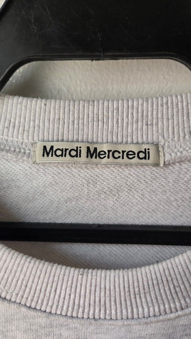 Mardi Mercredi Grey Flower Sweatshirt (Category: Longsleeves) located in Manila. Submitted by gratsimaravilla (Listing ID 1465189313, Image 3). Description: Grey marled sweatshirt from Mardi Mercredi. Large coral pink embroidered flower graphic on the front with bold red lettering. Crew neck style with ribbed cuffs and hem. Soft fleece lining inside. Has a small faint spot on the upper right sleeve near the shoulder. Comfortable oversized fit..