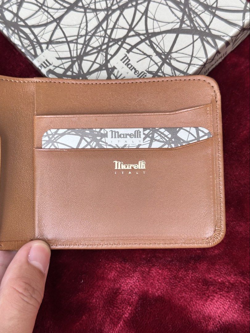 Marelli Italy Premium Lux Men’s wallet (Category: Wallets & Card Holders) located in Cagayan de Oro. Submitted by kjcartier26 (Listing ID 1465237219, Image 3). Description: Authentic, Complete set, Exquisite. 🇯🇵✨ - In Excellent condition - Compact size and Very durable quality - Minimal Stickyness inside powder, Due to unused and poor storage. But overall it doesn’t affect the Bags Authenticity..