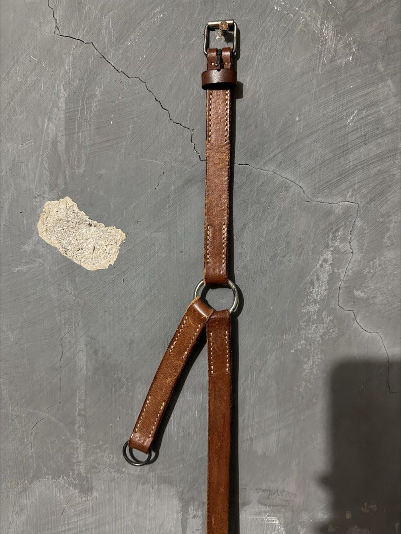 Margiela Belt (Category: Belts) located in Makati City. Submitted by homme.boy.plus (Listing ID 1465302784, Image 1). Description: Margiela Archival Belt Genuine Italian leather belt in rich brown Size 90 (32-34) with a unique Y-shape strap construction Beautiful vintage patina and wear marks that add character.